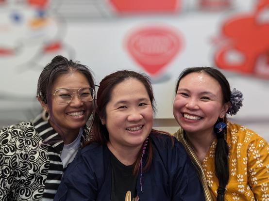 Three women smiling and wearing traditional Asian attire
Georgi, Mariatta Cheuk