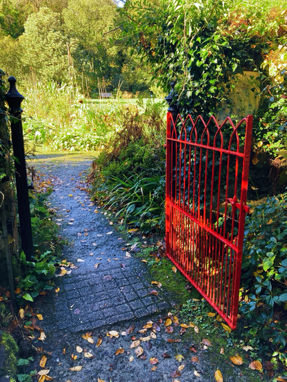 Red gate leading into garden