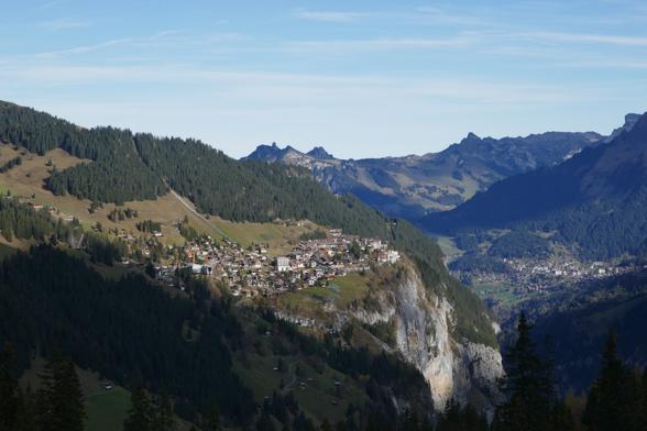 A mountain village above a steep rockface
