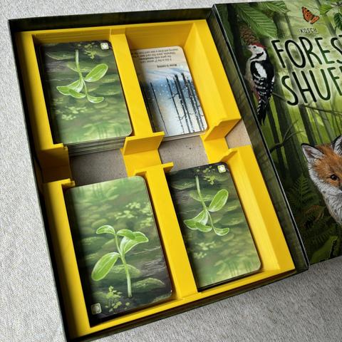 Yellow insert in the Forest Shuffle box, with space for 4 piles of cards