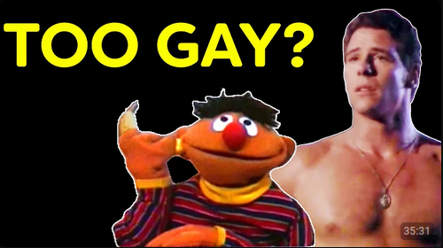 A YouTube thumnail. The background is flat black. In a white outline, the muppet Ernie holds a banana to his right ear slightly in front of a topless white man. Large, all upper case yellow letters spell out "too gay?" in the upper left hand side of the thumbnail.