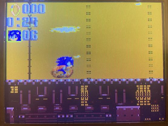 Sonic is speeding up in an industrial looking level.