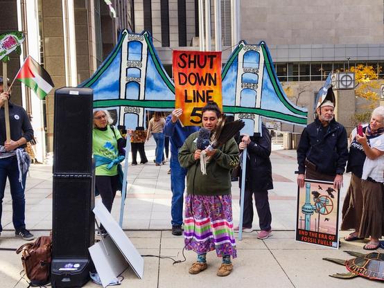 Amber Reimondo-Wilson speaks to the rally crowd outside the Canadian consulate in Chicago.