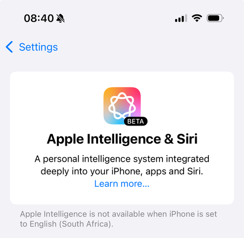 Screenshot of a Settings page saying: Apple Intelligence & Siri. A personal intelligence system integrated deeply into your iPhone, apps and Siri. Learn more... Apple Intelligence is not available when iPhone is set to English (South Africa).