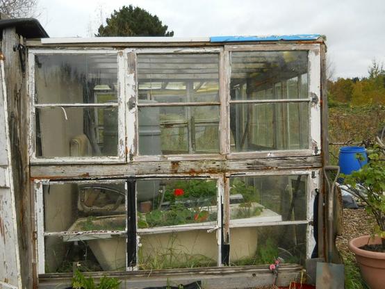 External view of greenhouse remade with 100yo windows recovered from somebody.