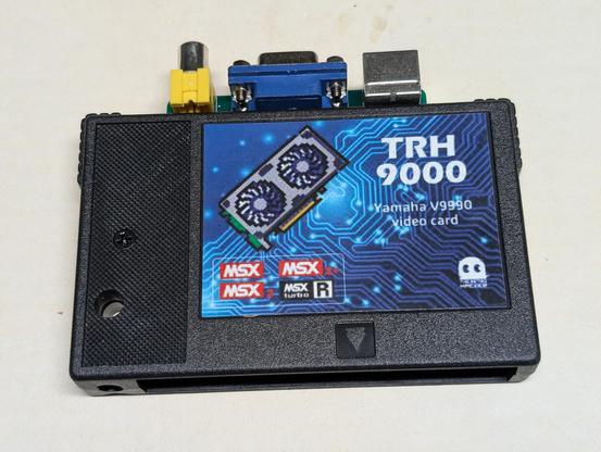 A photo of a TRH 9000 Yamaha V9990 video card for MSX computers. There are connectors for video output at the top.