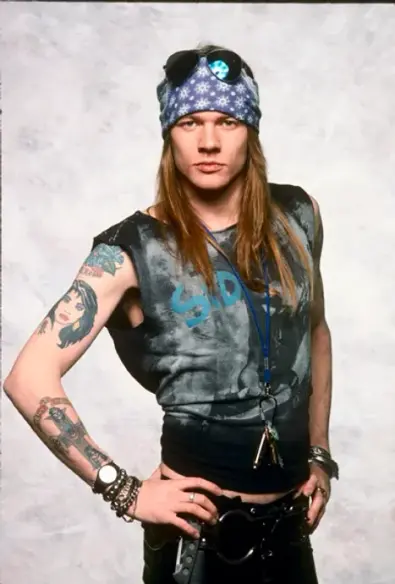 axl rose with hand on hip , swiveling his hip to the side