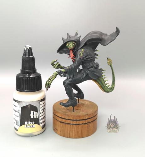Shapechanger - a lizard-like creature in torn clothing. currntly the skin is painted but the clothes are still black undercoat