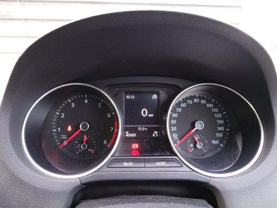dashboard of parked VW Polo 6C showing 40 000 miles on the odometer