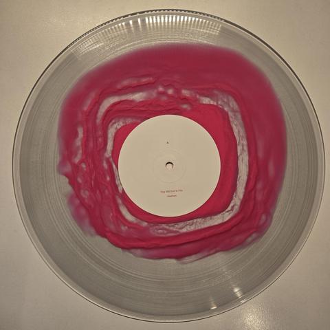A Swarm of the Sun's "An Empire" double gatefold LP, Subscriber Edition vinyl, Side A: transparent with pinkish, amorphous blob in the middle