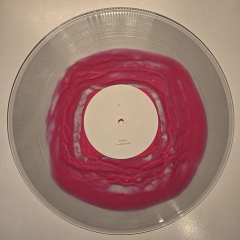A Swarm of the Sun's "An Empire" double gatefold LP, Subscriber Edition vinyl, Side C: transparent with pinkish, amorphous blob in the middle