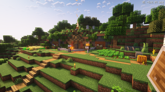 I built a starter base: A Minecraft Hobbit hole exterior built into a forest hill. Crops in the front yard, some seasonal pumpkins and general cottage core decorations.