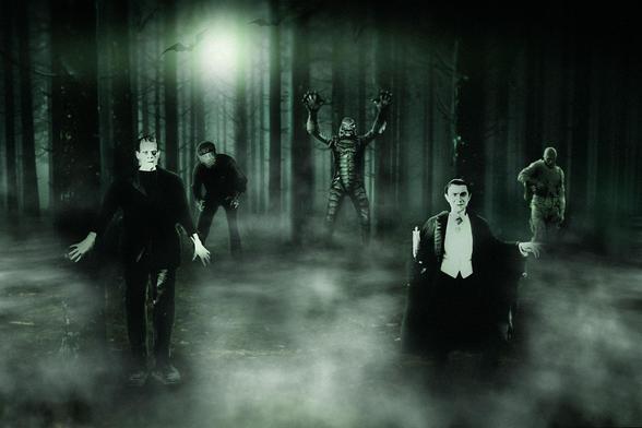 A Photoshop composite featuring classic Universal monsters (l-r) Frankenstein's Monster, the Wolfman, The Gill Man, Dracula and The Mummy in misty forest, bathed in an eerie pale green light