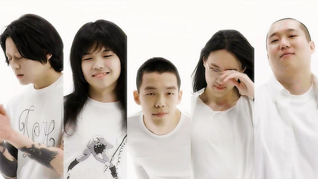 Screenshot from the Big Butt MV - Balming Tiger members wearing white.