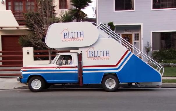 The truck the family in Arrested Development uses when their money runs out. It's a truck with stairs, used to get onto a large plane. The coloring is very similar to the trump truck (white, with blue and red trim)