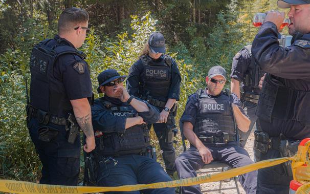 6 RCMP CIRG chumps including one female chump, all wearing thin blue line patches on uniforms.