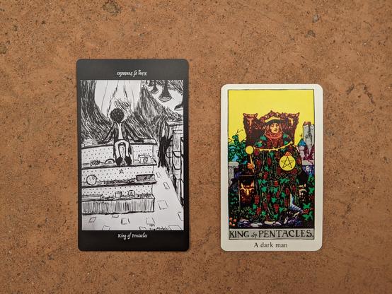 The King of Pentacles from the Elsewhere Tarot, showing a rough, sketchy drawing of a  dude with a sketchy/shadow head sitting on the display shelves in a shop, with another smaller sketchy/shadow entity with an animal-like vibe clambering at nearby shelving, alongside the King of Pentacles from a janky, bootleg RWS deck, showing a smug dude in robes adorned with images of ripe grapes who’s showing us a gold pentacle and not looking us in the eye.