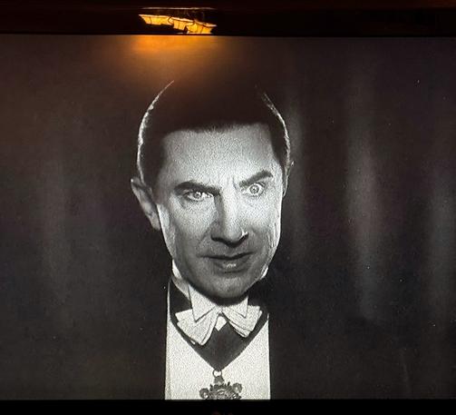 Close up of a black and white version of Dracula.