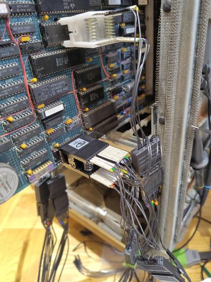 Logic analyser probes are clipped to chips on the PERQ EIO board: specifically, the boot ROM and the Z80. These are just a few dozen probe wires and already it looks like a bit of a mess!