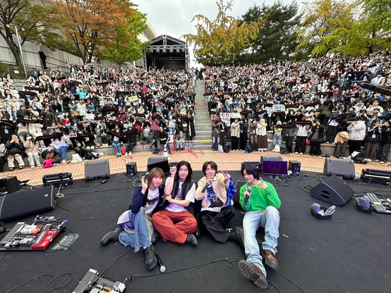 Dragon Pony at the Grand Mint Festival. Onstage with their audience behind them for the obligatory concert photo.