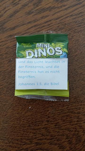 Package of mini dinos with attached verse from the bible.
