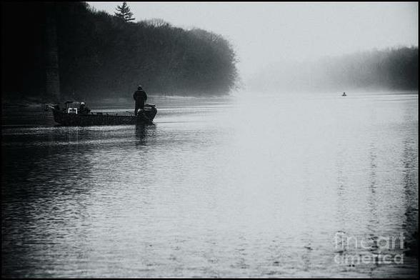 B&W photo of two men in a fishing boat on the Delaware River on a very foggy day