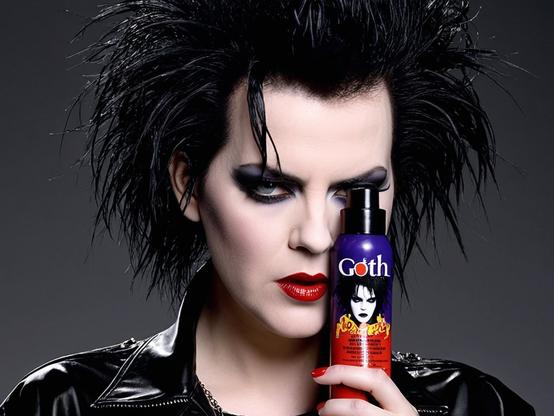 A goth holding a can of Goth Juice, the most powerful hairspray in the world. Made from the tears of Robert Smith.