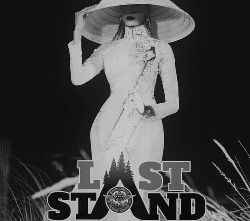 Last Stand for Ancient Forests promo shot - wearing white bamboo ao dai dress & rice bamboo traditional hat.
Black and white photo.