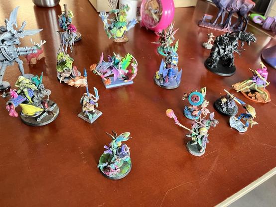 An assembly of kitbashed and very colourful minis.