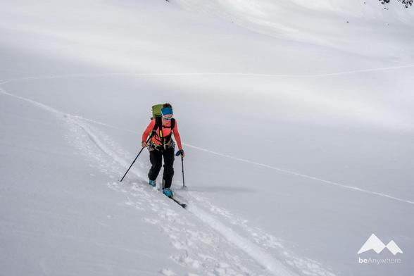 woman on a ski tour with full equipment.