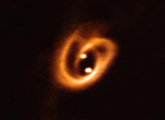 Disk and accretion of matter within a double protostar observed with the ALMA radio telescope. This double protostar, different from V347 Aur (whose brown dwarf companion is 10 times less massive than the central star), illustrates the complexity of matter flows from the disk to the stars within a protobinary. V347 Aur is far too close to its brown dwarf companion to be similarly imaged by ALMA. ALMA / ESO / NRAO / NAOJ, Alves et al 2019