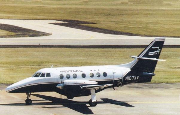 Little prop plane is scooting across the tarmac real fast. Right to Left.