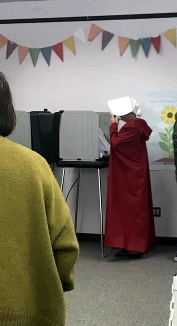 Woman dressed as 'Handmaid' votes in Asheville, North Carolina