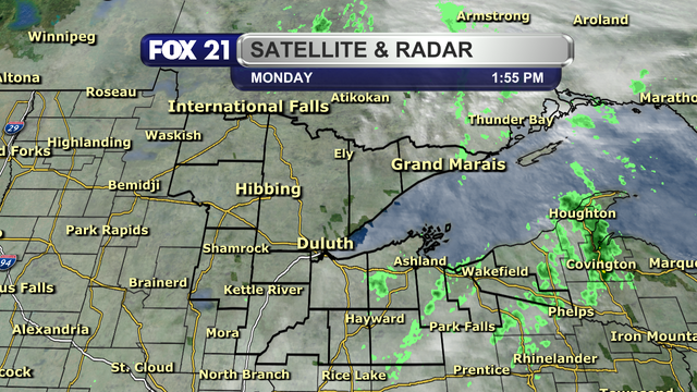 The satellite and radar over the Northland at 1:55 p.m. on Monday, November 4, 2024, shows lingering showers over the Arrowhead, northwest Wisconsin, and the Upper Peninsula regions.  Cloud cover is persistent throughout the area.