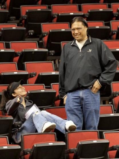 Me and my dad at a Seattle Storm Basketball game. Pictured is me sitting pointing to the cameraman (my friend) and my dad standing next to me 💜 RIP