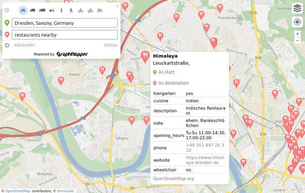 Shows GraphHopper Maps with the view at Dresden after the search query "restaurants nearby". It lists several markers on the map and one is a bit bigger which indicates the popup for the restaurant "Himalaya" which lists several other OpenStreetMap tags like indian cuisine. It also shows the ability to set the restaurant as start or destination.