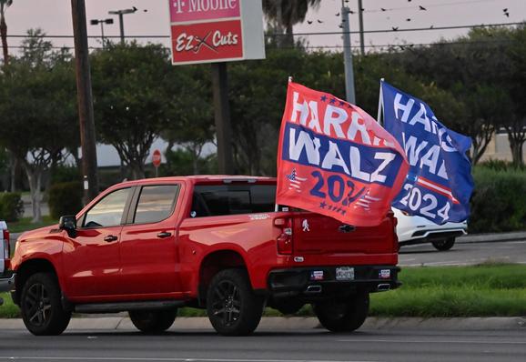 a red truck with giant HARRIS WALZ flags on the back.
Seen in McAllen, TX (miles from the southern border)