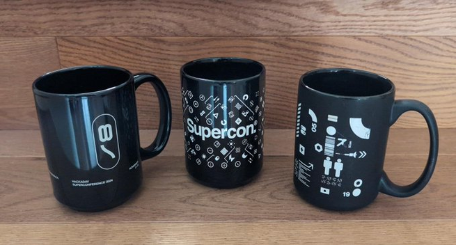 3 different black Superon mugs