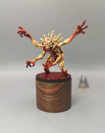 Howling Demon figure - a sickly yellow. gaunt and sinewy, wading through a lake of blood and waving its four arms menacingly