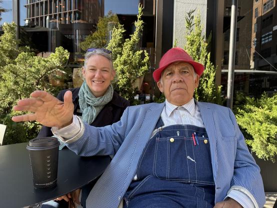 A handsome gentleman seated in the meatpacking district of #NYC wearing denim dungarees, a light blue jacket and a very natty raspberry coloured trilby. He’s holding up his right hand, mid-anecdote and has my wife next to him smiling broadly. He was quite a character and it was lovely to hear him talking about the time he met Trump. An arsehole, you’ll be shocked to hear.