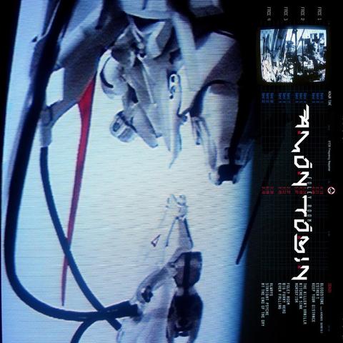 The cover art for the album 'Foley Room' by Amon Tobin.

The main part of the image is a photo of a CRT screen displaying some machinery in a white room.

Down the right hand side is another, smaller, shot of a CRT screen, which I *think* is showing the interior of a studio, but it's hard to make out (could well be a foley room, I guess). Also here is the artist's logo, album title, track listing, record company name and logo and catalogue number.