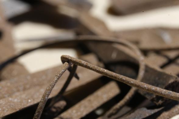 Macro photo of  linoleum pieces leftover from the first cuts.
