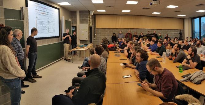 Picture of the devroom's organisers and visitors from 2024
