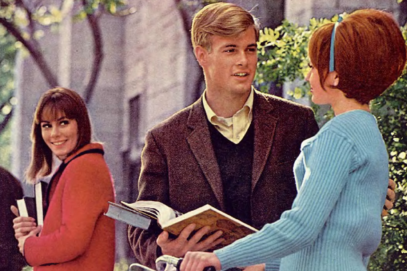 1965 High School Students in Conversation
In the image, we see a scene from what appears to be high school or college life.
A young man is engaged in conversation with two women who are holding books and appear attentive.