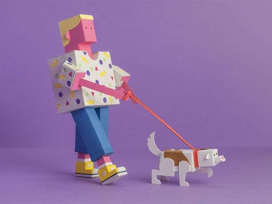 A papercraft figure of a person with a dog on a leash against a purple background.