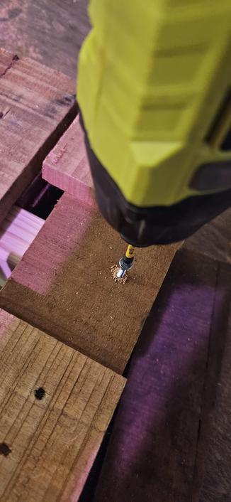 Screwing in supports for both sides.