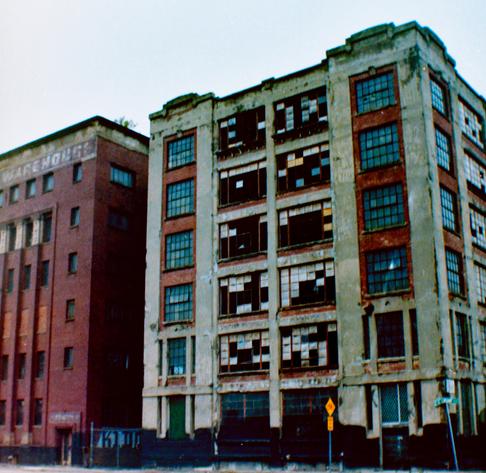 A shitty photo of two buildings in downtown Memphis, TN, showing heavy amounts of decay.