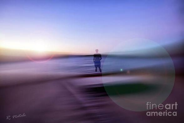 Abstract photo composite of a person walking into the water with a motion blur background to depict the Spirit of It