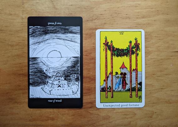 The Four of Wands from the Elsewhere Tarot, showing a rough, sketchy drawing of two figures in the sea watching the sunset (or sunrise) and a great sand castle in the foreground they must have made during their sunny, fun, beach day, alongside the Four of Wands from a janky, bootleg RWS deck, showing a living garland strung between two wands in the foreground, and two joyful women with raised bouquets of flowers beyond it, and a lovely medieval Italian city in the background.