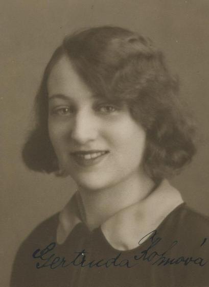 Vintage portrait of a young woman, featuring a close-up of a smiling individual with curly hair, looking directly at the camera.